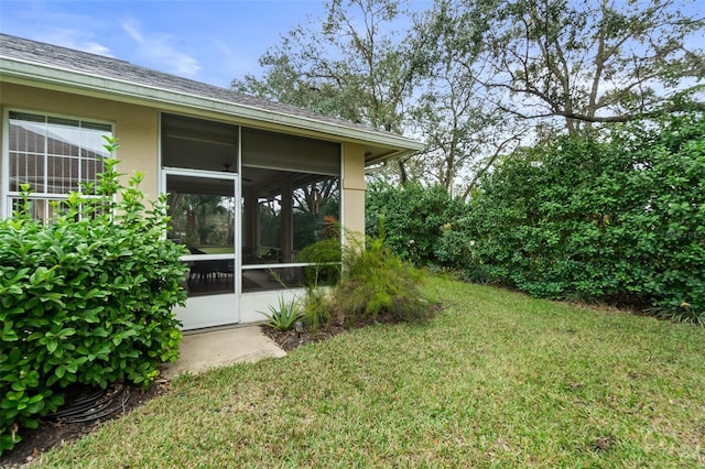 view of yard with a sunroom