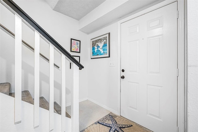 foyer featuring light tile patterned floors