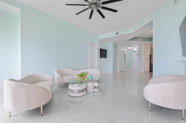 sitting room with ceiling fan