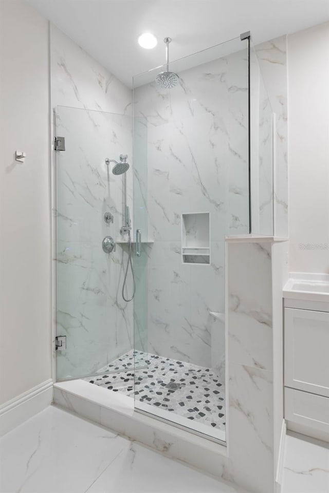 bathroom with vanity and walk in shower