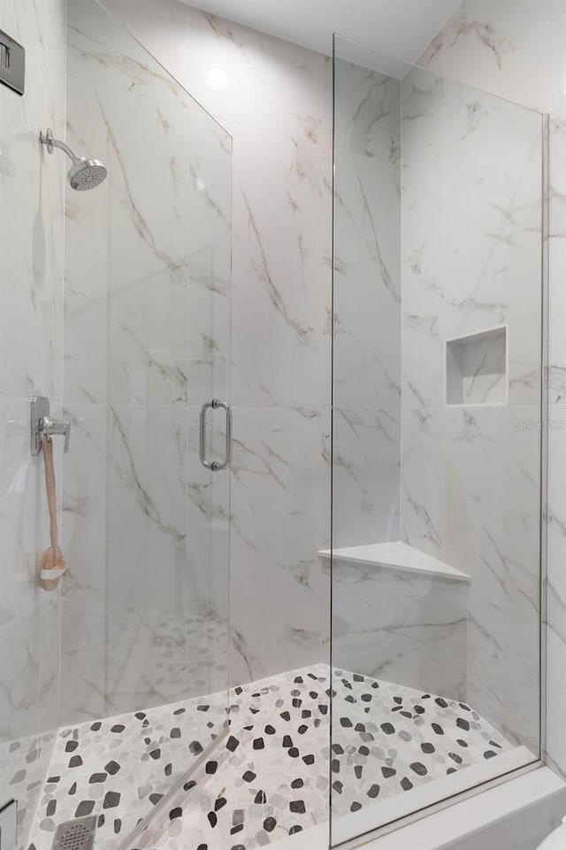 bathroom featuring an enclosed shower