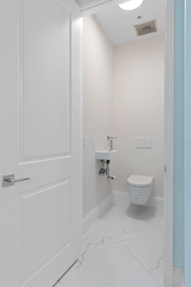 bathroom featuring toilet