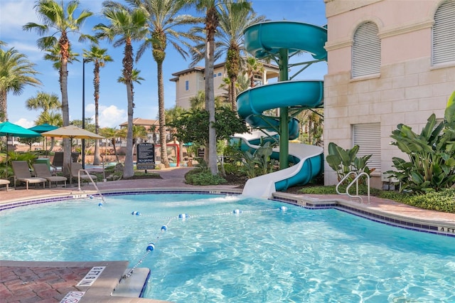 view of pool with a water slide