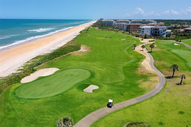 drone / aerial view with a water view and a beach view