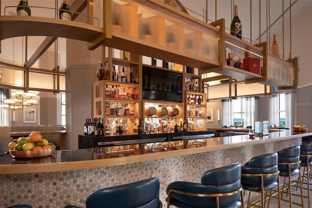bar featuring a high ceiling