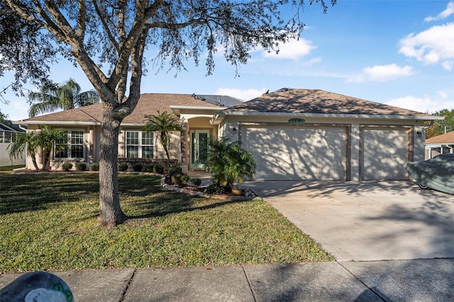 ranch-style house with a garage and a front yard