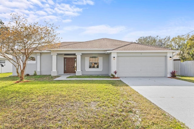 ranch-style house featuring a front yard and a garage