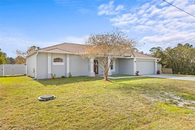 view of front of home with a front lawn and a garage