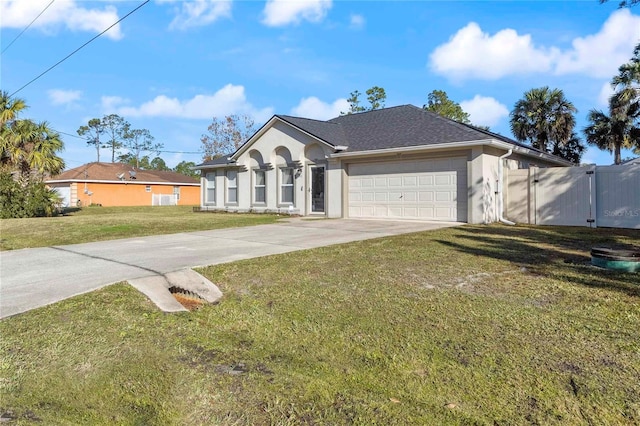 ranch-style home featuring a garage and a front yard