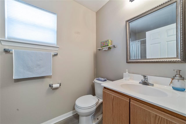 bathroom with a shower with shower curtain, vanity, toilet, and hardwood / wood-style floors