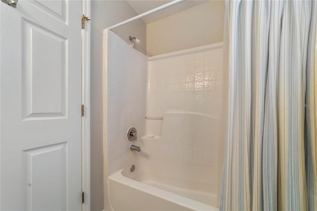 bathroom with shower / bath combination with curtain