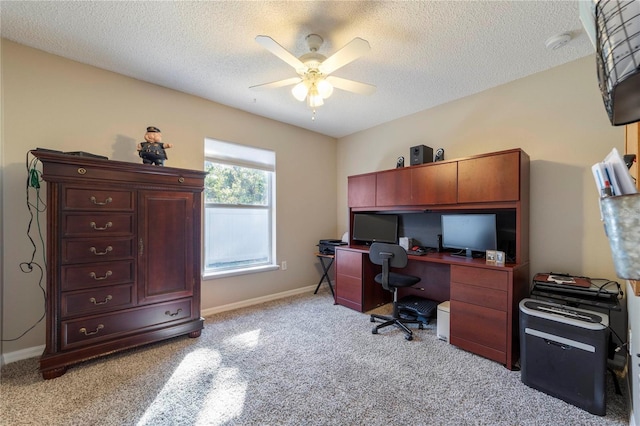 office with light carpet, ceiling fan, and a textured ceiling