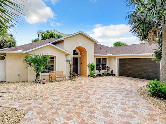 ranch-style house featuring a garage