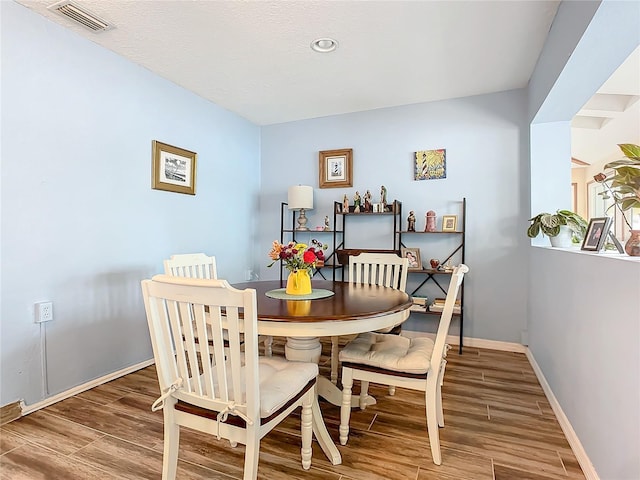 dining area featuring wood-type flooring