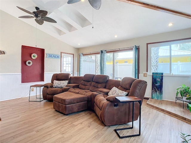 living room featuring vaulted ceiling with beams, light hardwood / wood-style flooring, and ceiling fan