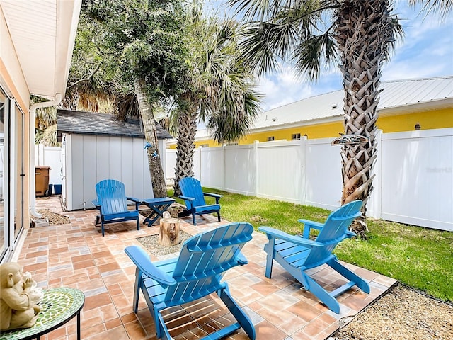 view of patio / terrace with a storage shed