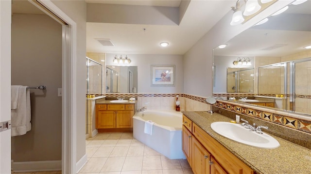 bathroom featuring tile patterned floors, backsplash, separate shower and tub, and vanity