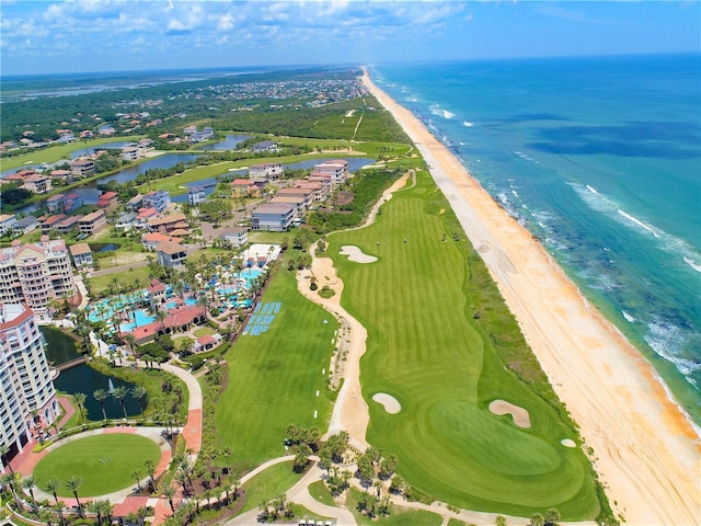 drone / aerial view with a water view and a view of the beach