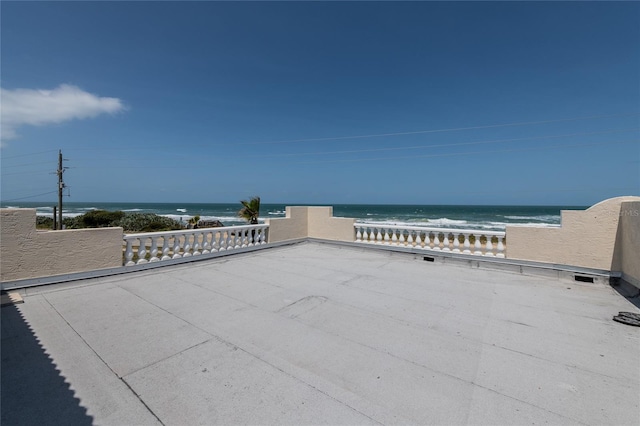 view of patio with a water view