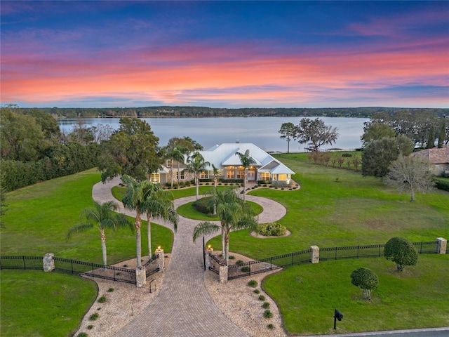 aerial view at dusk with a water view