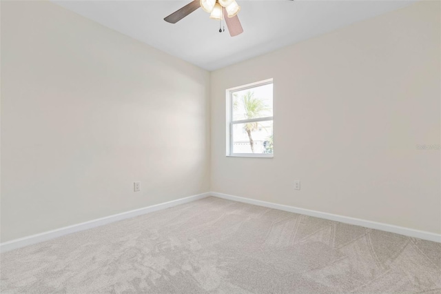 empty room featuring ceiling fan and carpet floors