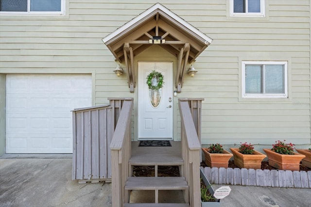 view of exterior entry with a garage