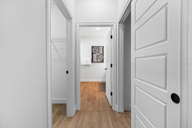 corridor featuring light wood-type flooring