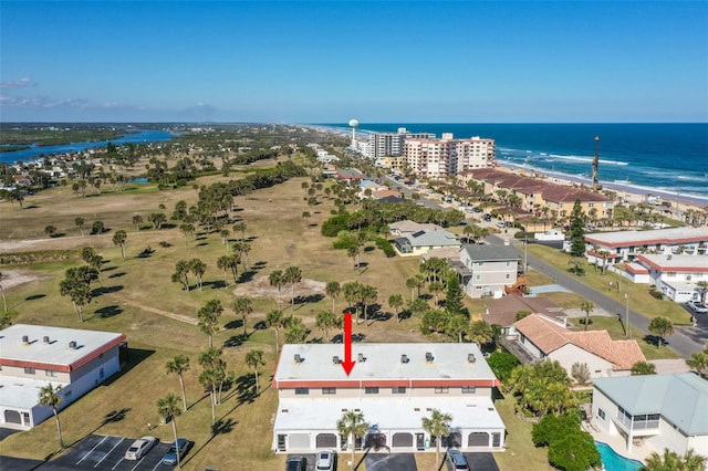 aerial view featuring a water view and a beach view