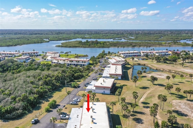 birds eye view of property with a water view