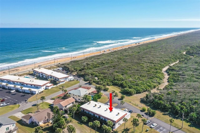 aerial view featuring a water view and a beach view