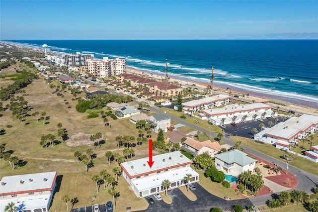 birds eye view of property featuring a view of the beach and a water view