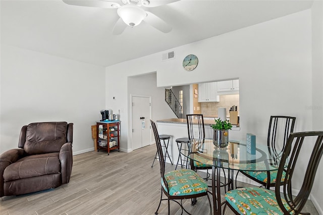 dining space featuring ceiling fan and light hardwood / wood-style floors