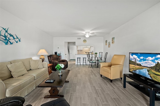 living room featuring ceiling fan