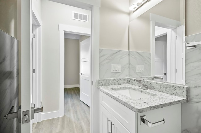 bathroom with wood-type flooring and vanity