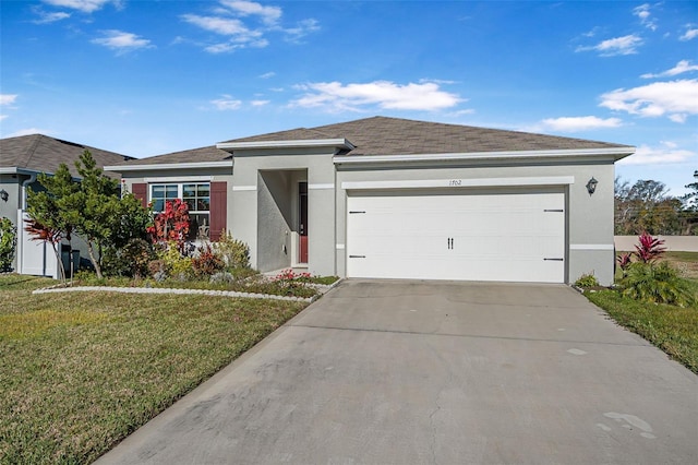 view of front of house featuring a front lawn and a garage