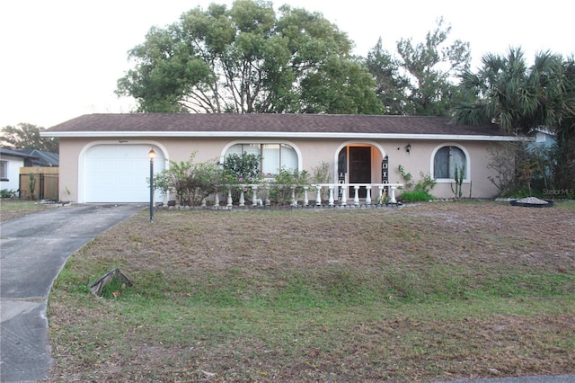 ranch-style home with a garage