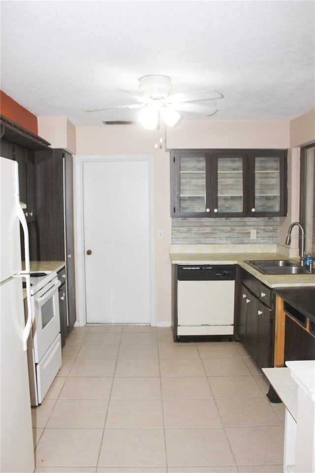 kitchen with ceiling fan, sink, light tile patterned floors, and white appliances