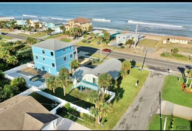 bird's eye view with a water view and a view of the beach