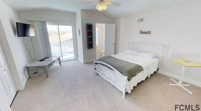 bedroom featuring access to exterior, light colored carpet, and ceiling fan