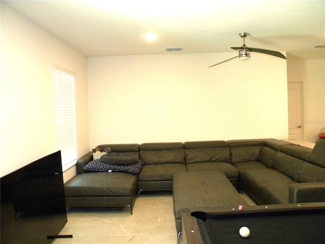 living room featuring ceiling fan