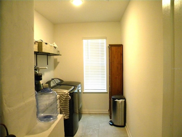 washroom featuring light tile patterned flooring and independent washer and dryer