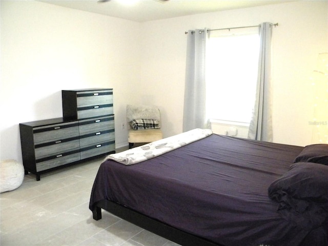bedroom featuring light tile patterned floors