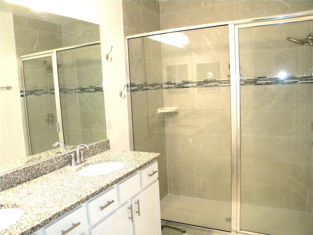 bathroom with vanity and an enclosed shower