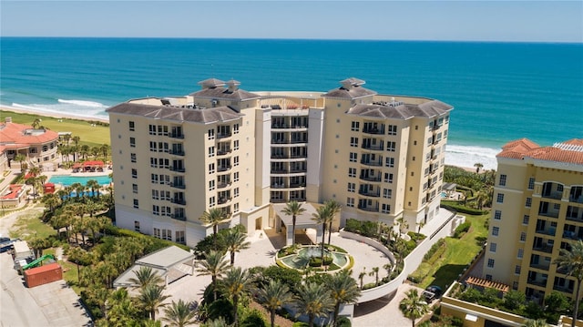 bird's eye view with a water view and a view of the beach