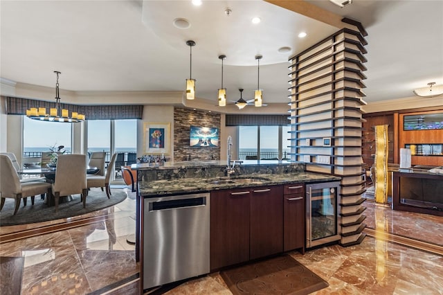 kitchen with pendant lighting, sink, stainless steel dishwasher, dark stone countertops, and beverage cooler