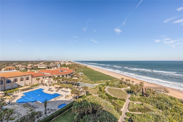 drone / aerial view featuring a water view and a beach view