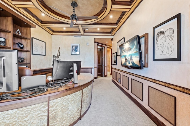 carpeted office space with beamed ceiling, ceiling fan, ornamental molding, and coffered ceiling