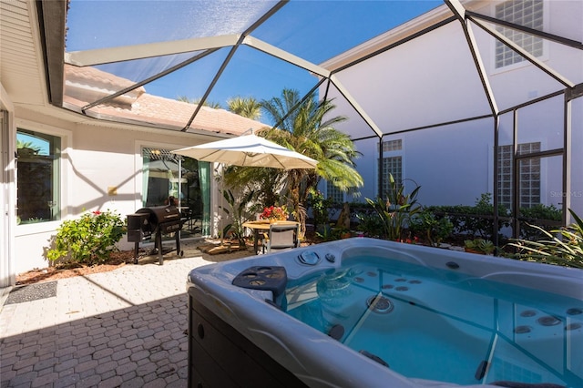 view of swimming pool featuring a lanai, a grill, a patio, and a hot tub