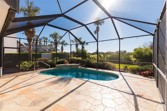 view of swimming pool with a patio and a lanai