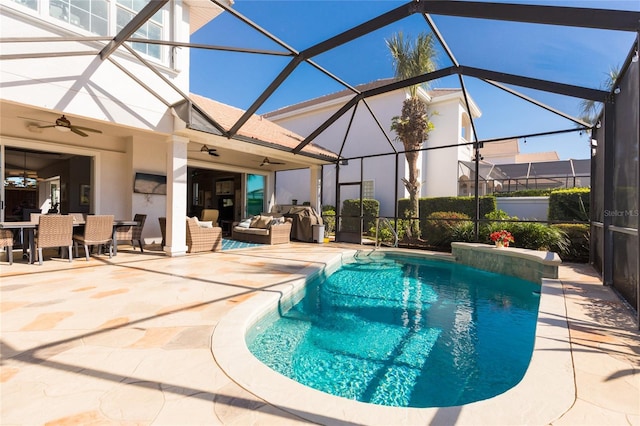 view of swimming pool with a lanai, a patio area, ceiling fan, and an outdoor hangout area